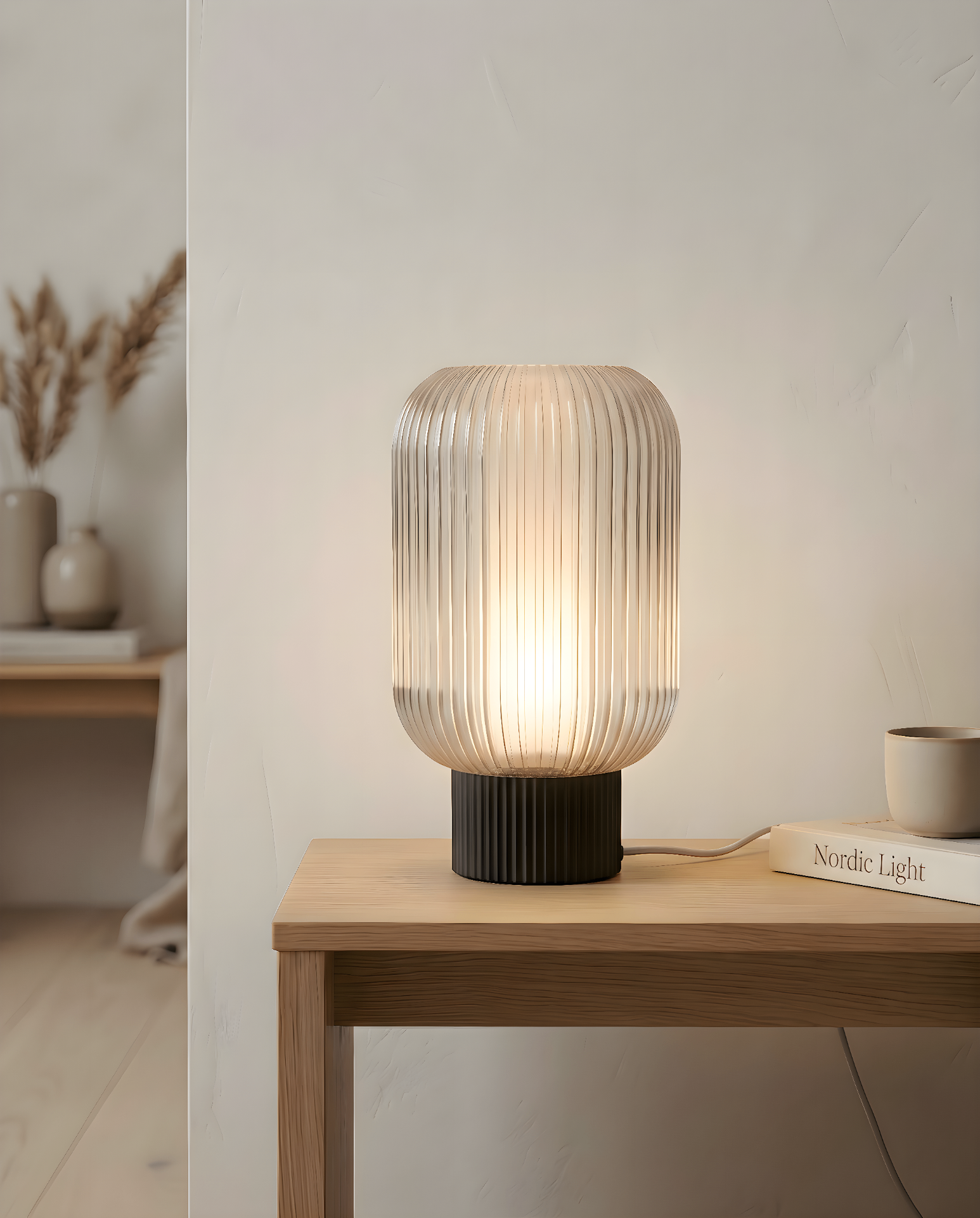 The Altus table lamp on an oak console